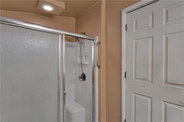 full bath with a shower with door