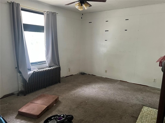 2504 Olympia St, Mckeesport, PA 15132 - carpeted empty room with radiator and a ceiling fan