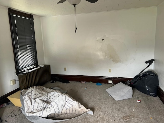 2504 Olympia St, Mckeesport, PA 15132 - unfurnished bedroom featuring radiator heating unit, carpet floors, crown molding, and a ceiling fan