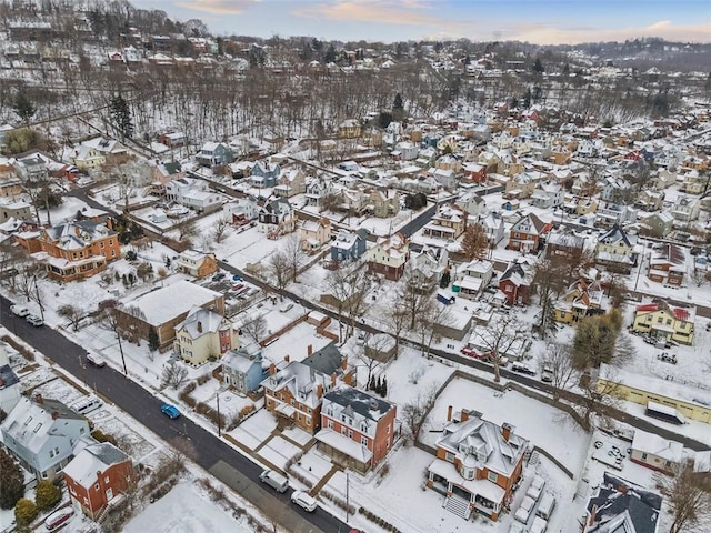 snowy aerial view featuring a residential view