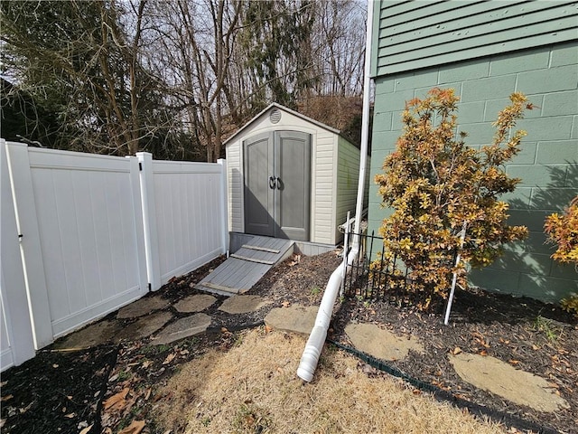 view of shed with fence