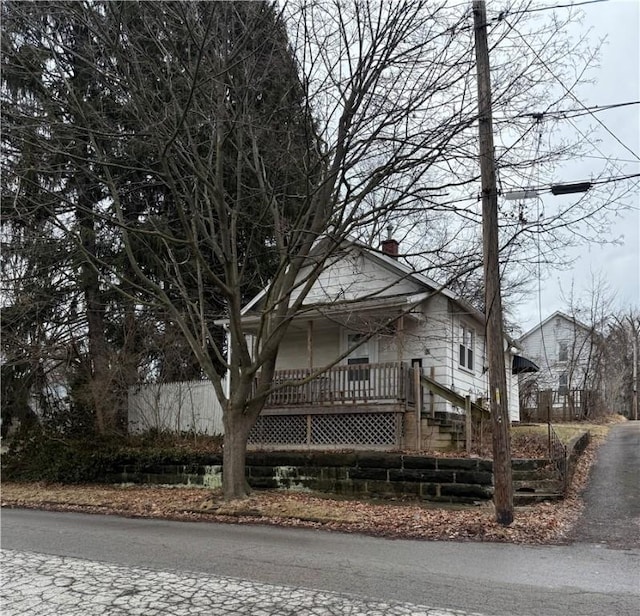 view of side of property featuring a chimney