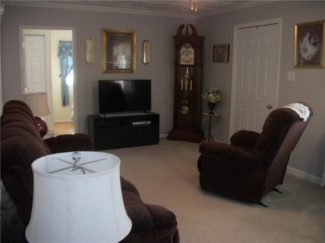 carpeted living area with ceiling fan, ornamental molding, and baseboards