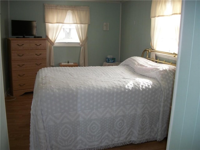 bedroom with wood finished floors