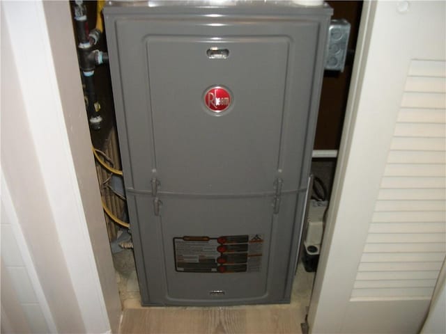 utility room featuring heating unit