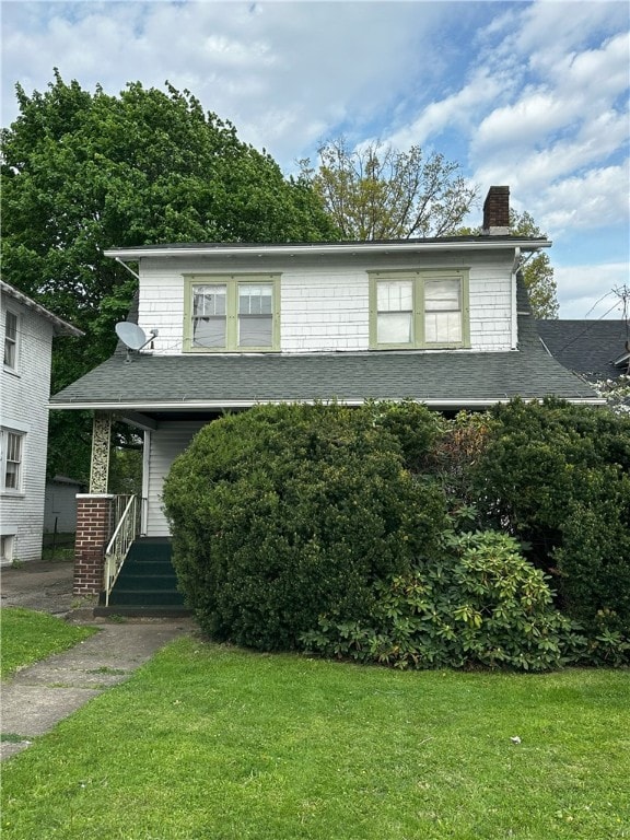 1104 Wilmington Ave, New Castle/1St, PA 16101 - view of front of property with a porch, a chimney, a shingled roof, and a front lawn