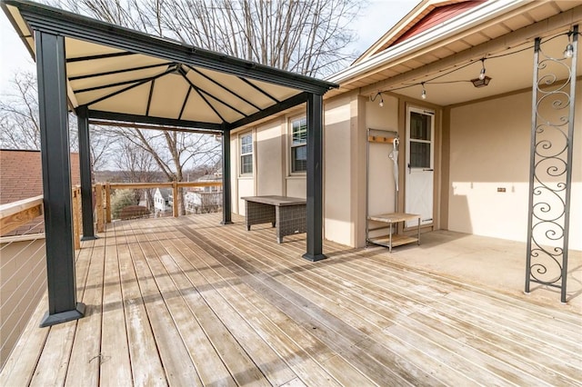 wooden terrace with a gazebo