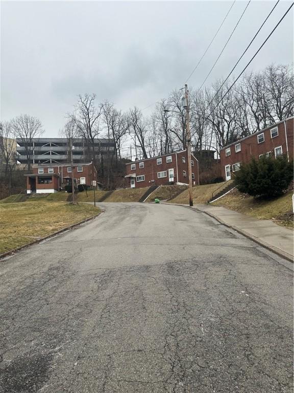 view of street featuring sidewalks and curbs