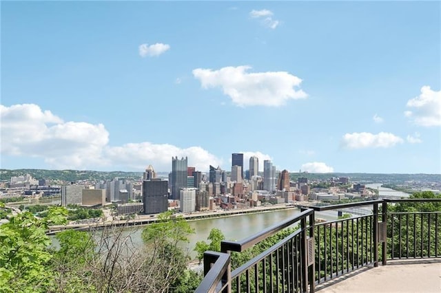 balcony with a view of city and a water view