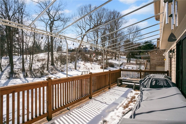 view of snow covered deck