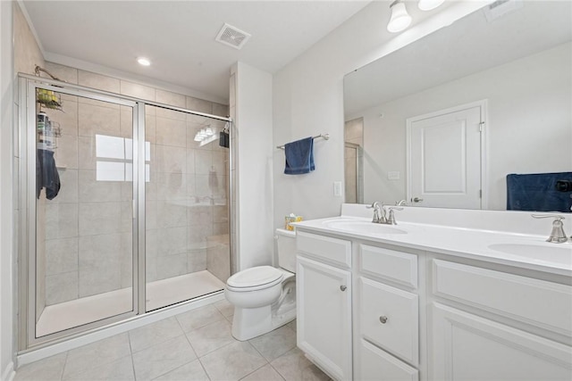 full bath with double vanity, visible vents, a stall shower, a sink, and tile patterned flooring