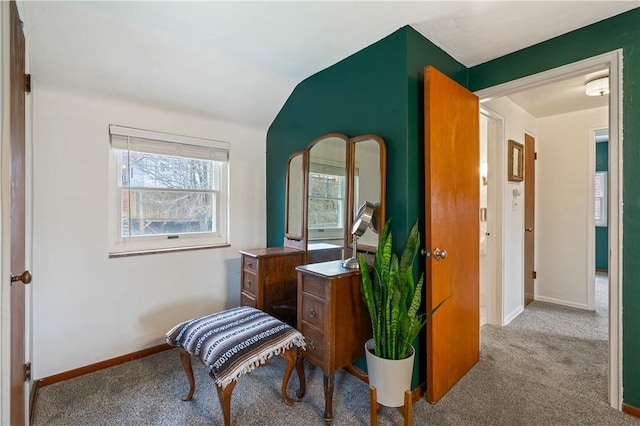 sitting room with light carpet, baseboards, and vaulted ceiling