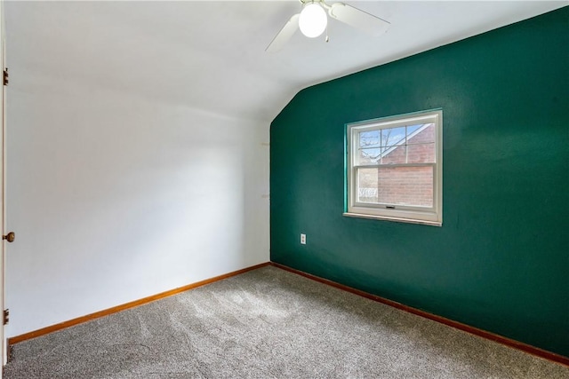 additional living space featuring carpet floors, baseboards, vaulted ceiling, and a ceiling fan