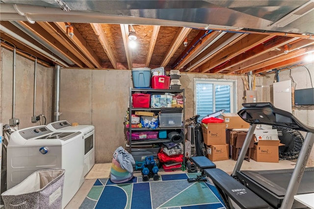 unfinished below grade area featuring separate washer and dryer