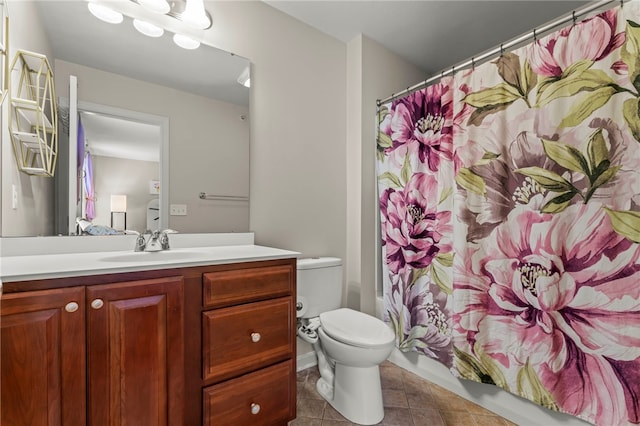 bathroom with toilet, tile patterned floors, a shower with shower curtain, and vanity