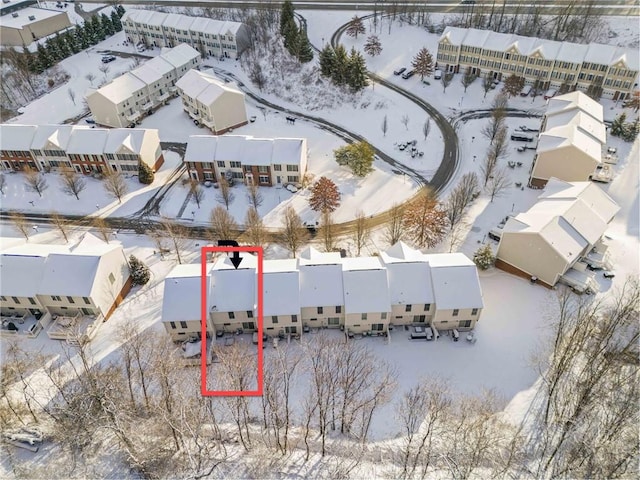 snowy aerial view featuring a residential view