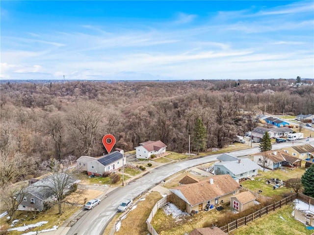 birds eye view of property with a residential view and a forest view