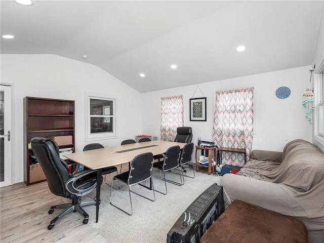 office space featuring light wood-type flooring, vaulted ceiling, and recessed lighting