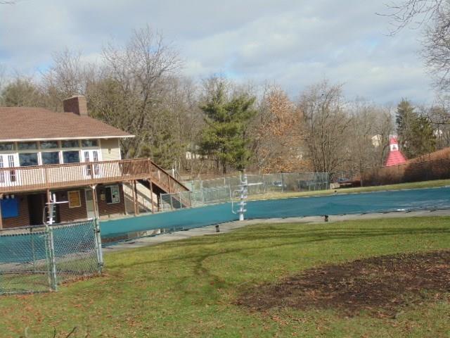 view of yard featuring fence and a wooden deck