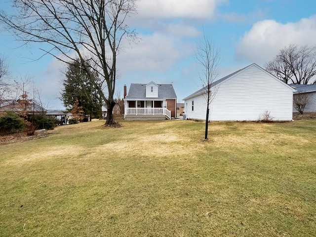 view of yard with covered porch