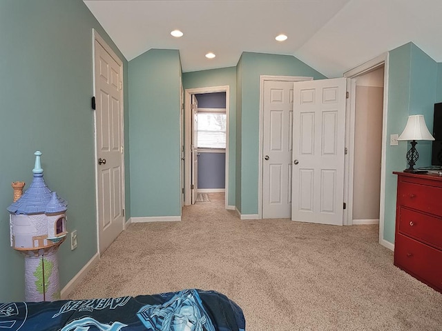 bedroom featuring baseboards, light colored carpet, vaulted ceiling, a closet, and recessed lighting