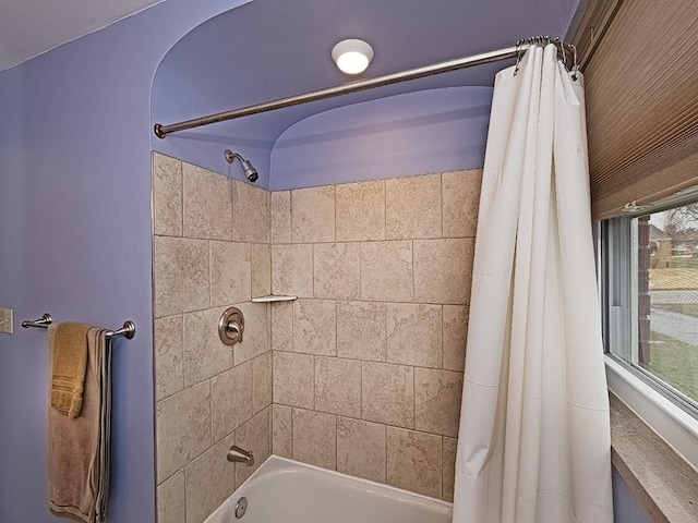 bathroom featuring shower / bath combo with shower curtain