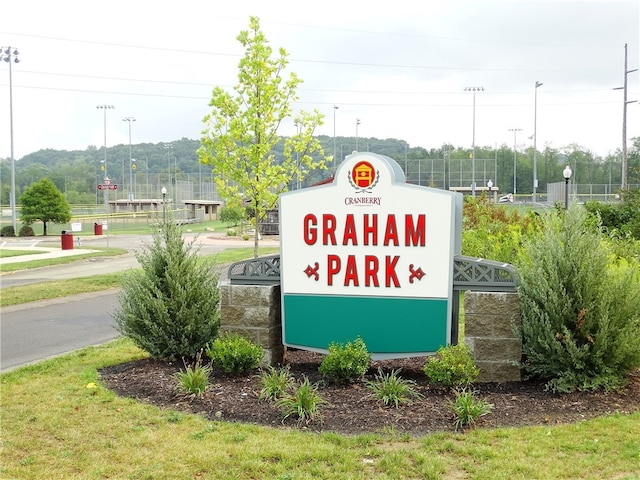 community sign featuring fence