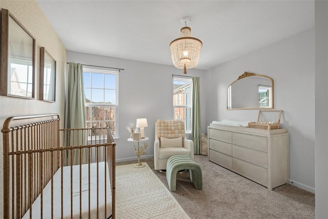 living area featuring carpet, plenty of natural light, and baseboards