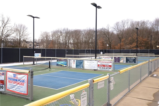 view of sport court with fence