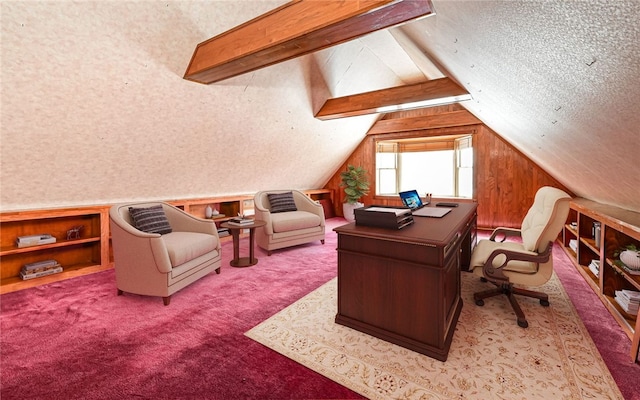 carpeted home office featuring lofted ceiling with beams and a textured ceiling