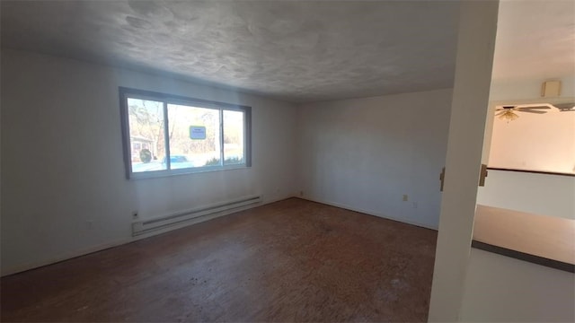 unfurnished room featuring a textured ceiling and baseboard heating