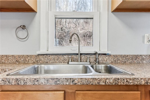 room details featuring light countertops and a sink