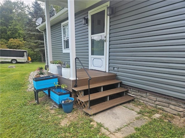 wooden deck with a lawn