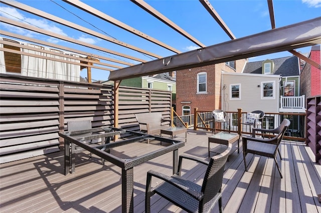 deck featuring an outdoor hangout area and a pergola