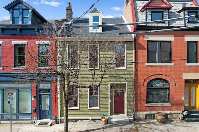 view of front of home featuring brick siding