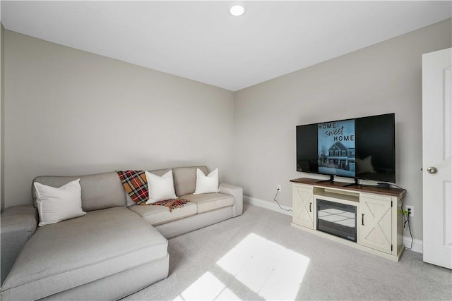 living room with carpet floors and baseboards