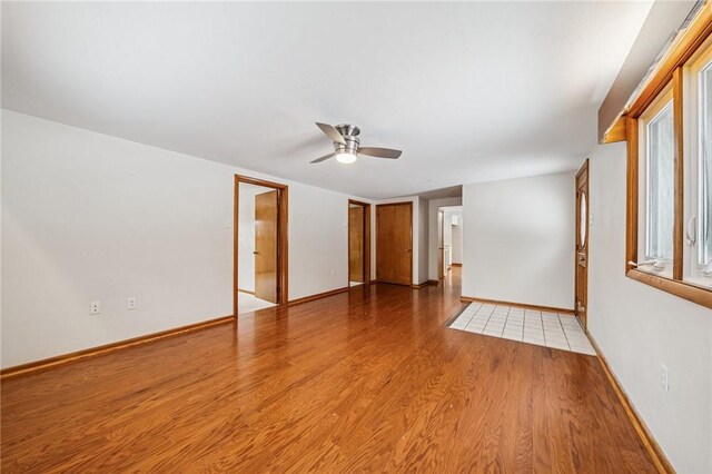 2972 Benshoff Hill Rd, Pa, PA 15909 - spare room with baseboards, light wood-style floors, and a ceiling fan