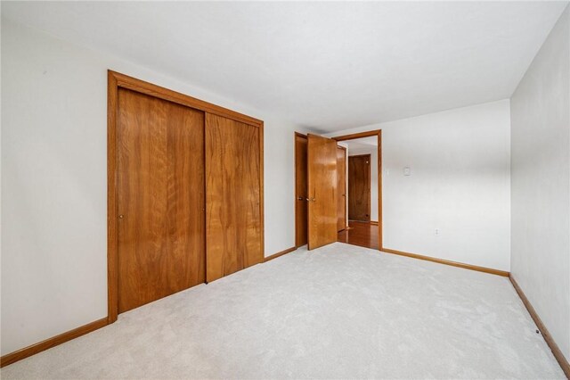 2972 Benshoff Hill Rd, Pa, PA 15909 - unfurnished bedroom with carpet floors, baseboards, and a closet