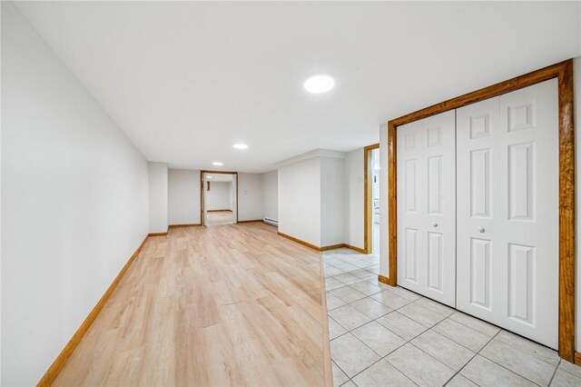 2972 Benshoff Hill Rd, Pa, PA 15909 - interior space with a baseboard radiator, light wood-style flooring, and baseboards