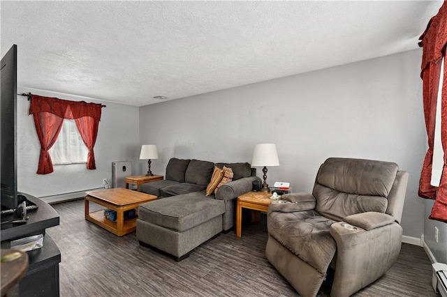 living room with dark wood-type flooring, baseboards, a textured ceiling, and baseboard heating