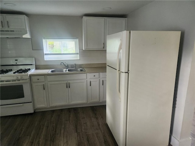 kitchen with white appliances, under cabinet range hood, white cabinetry, and a sink