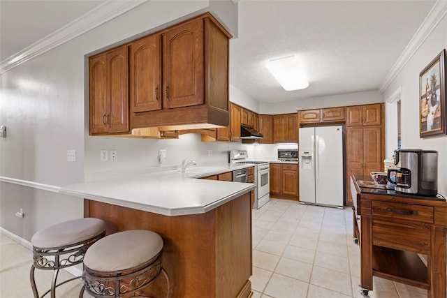1143 Links Way W, Deer, PA 15044 - kitchen featuring white appliances, under cabinet range hood, a peninsula, brown cabinetry, and ornamental molding