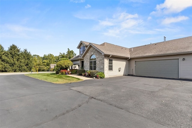 1143 Links Way W, Deer, PA 15044 - view of front of property with asphalt driveway, a garage, and a front lawn
