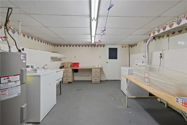 interior space featuring laundry area, separate washer and dryer, a sink, and electric water heater