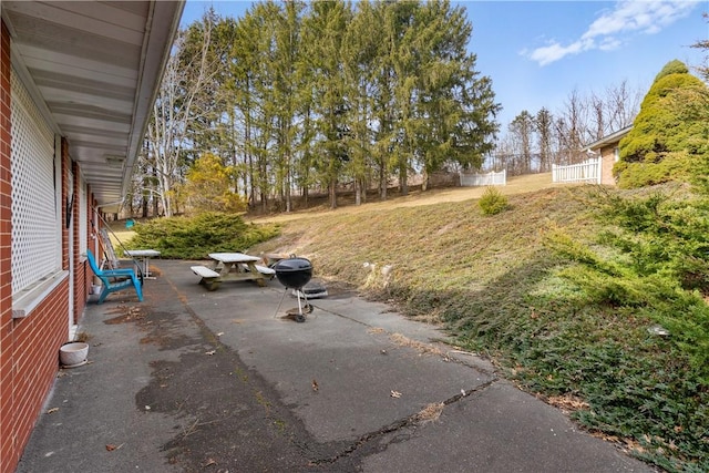 view of patio featuring fence