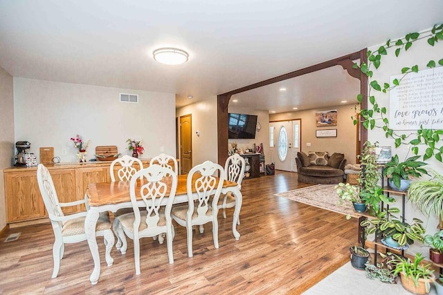 dining room with visible vents and light wood-style flooring