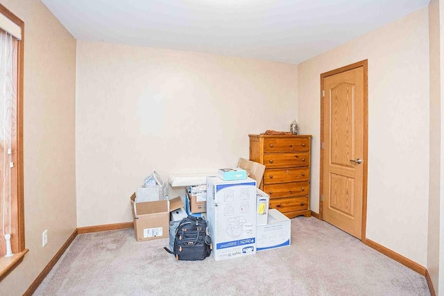 miscellaneous room with carpet and baseboards