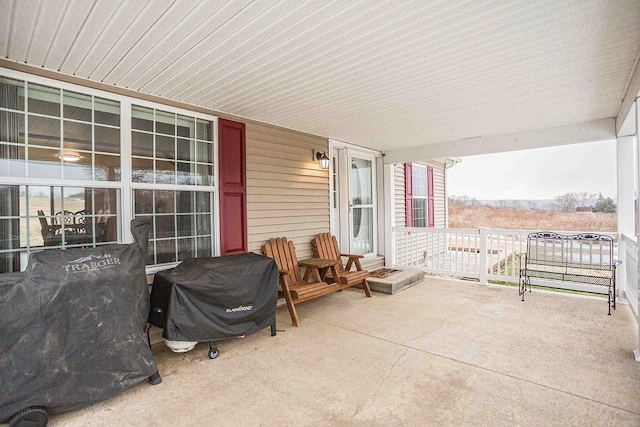 view of patio featuring a grill