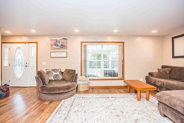 living room with recessed lighting and wood finished floors