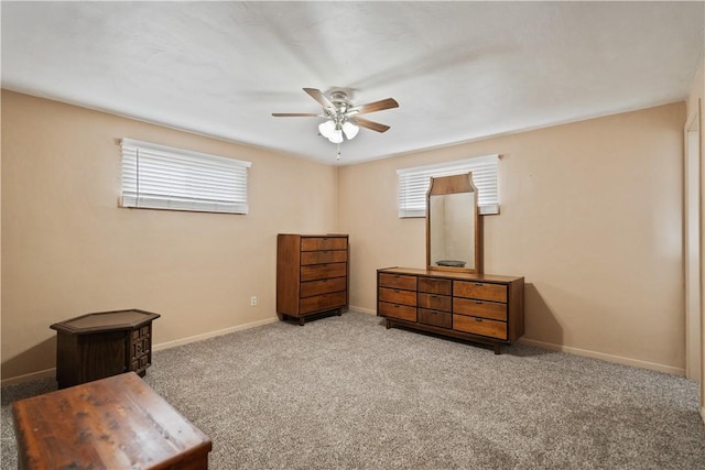 bedroom with light carpet, ceiling fan, and baseboards